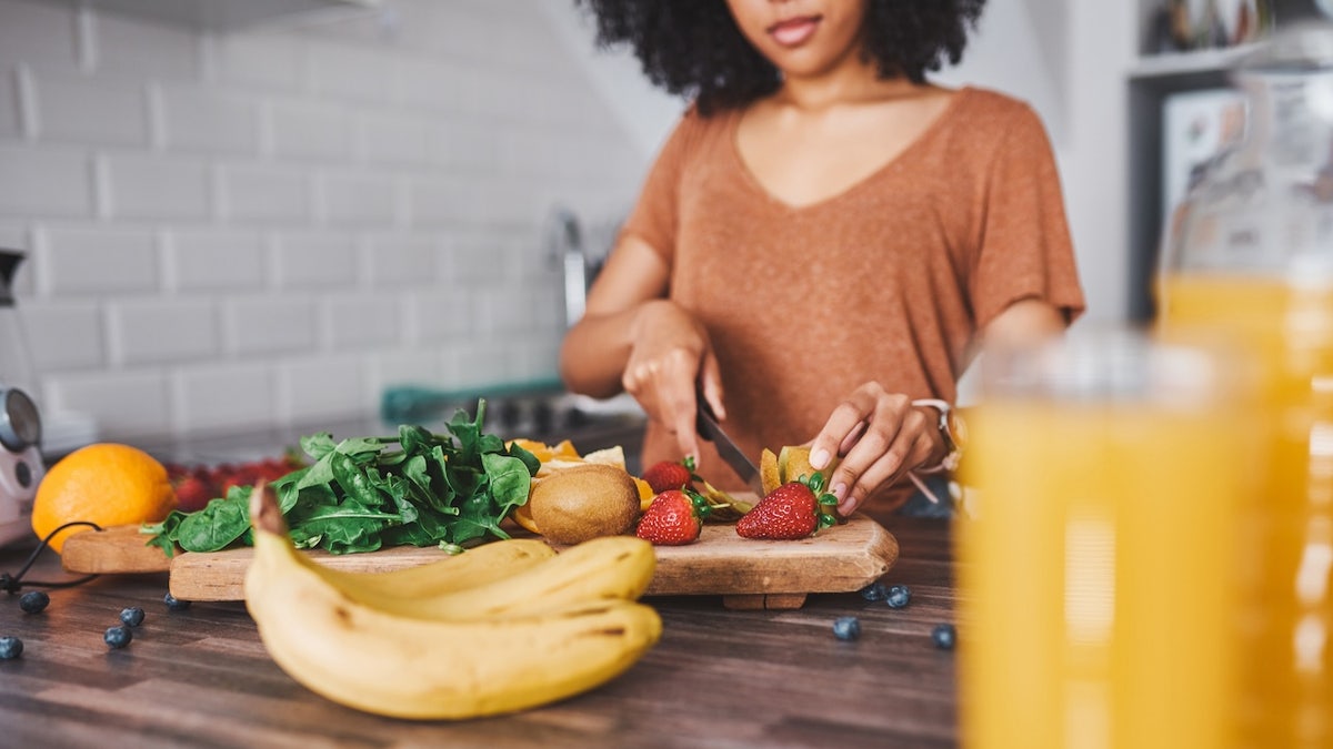 woman cutting fruit.jpg